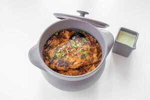 Khaleeji Hammour rice or fish biryani served in a dish isolated on grey background top view photo