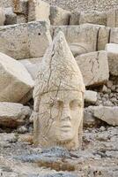 Apollo statue near the Commagene King Antiochus I tomb on the top of Mount Nemrut, Adiyaman province, Turkey photo