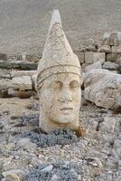 Apollo statue near the Commagene King Antiochus I tomb on the top of Mount Nemrut, Adiyaman province, Turkey photo