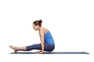 Woman doing Hatha asana Utpluti dandasana   lifted stuff pose photo