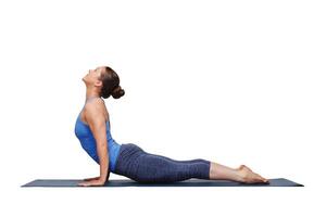 Woman doing Ashtanga Vinyasa yoga Sun Salutation asana photo