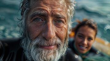 A man with a jawdropping beard is standing in the water, smiling happily next to a woman. He resembles a fictional movie character with a moustache, adding fun to the scene photo