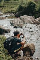 Asian Model, Adventurous Hiking Amid Sentul's Pine Forests, Crossing Rivers, Embracing Nature's Beauty in Indonesia photo