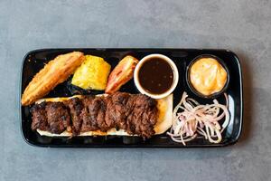 Beef Bihari tikka boti seekh Kabab with chili sauce, dip and onion served in dish isolated on table top view of asian and indian food photo