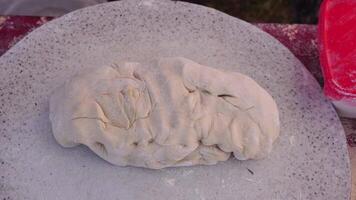 Adult woman making chebureks - roasts chebureks in pan, prepares meat pies, working with the dough and filling, close-up. Fried flatbread piadina naan pita tortilla shelpek cheburek. Street food. video