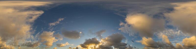 Dark blue sunset sky panorama with Cumulus clouds. Seamless hdr pano in spherical equirectangular format. Complete zenith for 3D visualization, game and sky replacement for aerial drone 360 panoramas. photo