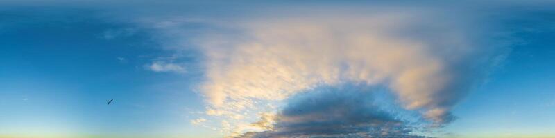 Dark blue sunset sky panorama with Cumulus clouds. Seamless hdr pano in spherical equirectangular format. Complete zenith for 3D visualization, game and sky replacement for aerial drone 360 panoramas. photo