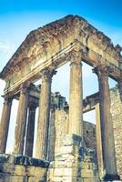 Remaining of the roman City of Dougga with the Capitol, Tunisia photo