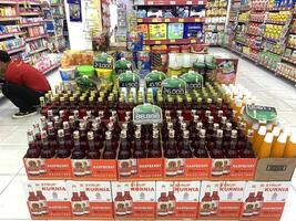 Indonesia - Sibolga, 5 February 2024 Various kinds of syrup products are arranged on supermarket shelves for consumers to buy photo