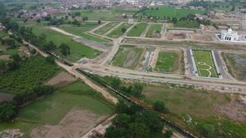 Rectangular shaped settlement of the rich district, looking down aerial view from above Bird eye view villas with pool on 2023-07-22 in Lahore Pakistan video