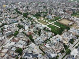 Rectangular shaped settlement of the rich district, looking down aerial view from above Bird eye view villas with pool on 2023-07-22 in Lahore Pakistan photo