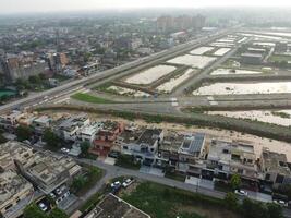 Rectangular shaped settlement of the rich district, looking down aerial view from above Bird eye view villas with pool on 2023-07-22 in Lahore Pakistan photo