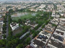 Rectangular shaped settlement of the rich district, looking down aerial view from above Bird eye view villas with pool on 2023-07-22 in Lahore Pakistan photo