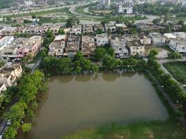 Rectangular shaped settlement of the rich district, looking down aerial view from above Bird eye view villas with pool on 2023-07-22 in Lahore Pakistan photo