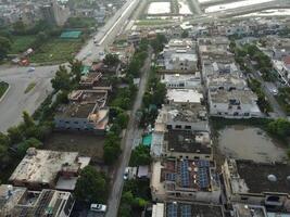 Rectangular shaped settlement of the rich district, looking down aerial view from above Bird eye view villas with pool on 2023-07-22 in Lahore Pakistan photo