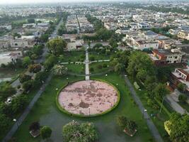 View at city from bird sight. City from drone. Aerial photo. City scape from drone on 2023-07-22 in Lahore Pakistan photo