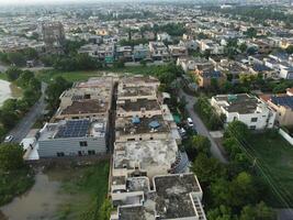 View at city from bird sight. City from drone. Aerial photo. City scape from drone on 2023-07-22 in Lahore Pakistan photo