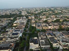 View at city from bird sight. City from drone. Aerial photo. City scape from drone on 2023-07-22 in Lahore Pakistan photo