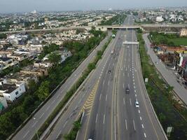 View at city from bird sight. City from drone. Aerial photo. City scape from drone on 2023-07-22 in Lahore Pakistan photo