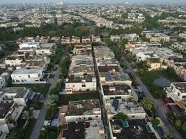 View at city from bird sight. City from drone. Aerial photo. City scape from drone on 2023-07-22 in Lahore Pakistan photo