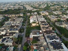 View at city from bird sight. City from drone. Aerial photo. City scape from drone on 2023-07-22 in Lahore Pakistan photo