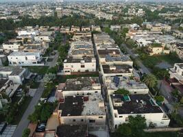 View at city from bird sight. City from drone. Aerial photo. City scape from drone on 2023-07-22 in Lahore Pakistan photo