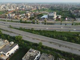 View at city from bird sight. City from drone. Aerial photo. City scape from drone on 2023-07-22 in Lahore Pakistan photo