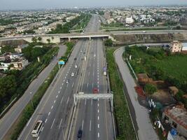 View at city from bird sight. City from drone. Aerial photo. City scape from drone on 2023-07-22 in Lahore Pakistan photo