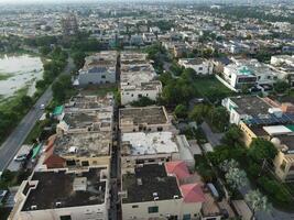 View at city from bird sight. City from drone. Aerial photo. City scape from drone on 2023-07-22 in Lahore Pakistan photo