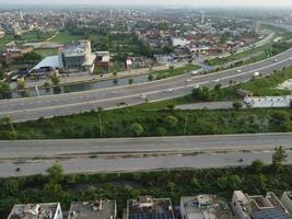 View at city from bird sight. City from drone. Aerial photo. City scape from drone on 2023-07-22 in Lahore Pakistan photo