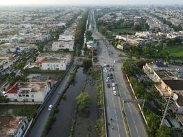 View at city from bird sight. City from drone. Aerial photo. City scape from drone on 2023-07-22 in Lahore Pakistan photo