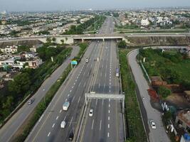 View at city from bird sight. City from drone. Aerial photo. City scape from drone on 2023-07-22 in Lahore Pakistan photo