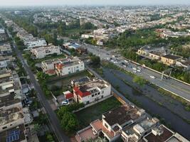 View at city from bird sight. City from drone. Aerial photo. City scape from drone on 2023-07-22 in Lahore Pakistan photo