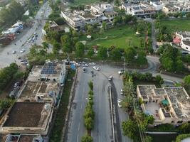 View at city from bird sight. City from drone. Aerial photo. City scape from drone on 2023-07-22 in Lahore Pakistan photo