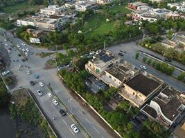 View at city from bird sight. City from drone. Aerial photo. City scape from drone on 2023-07-22 in Lahore Pakistan photo