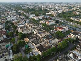 View at city from bird sight. City from drone. Aerial photo. City scape from drone on 2023-07-22 in Lahore Pakistan photo