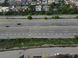 View at city from bird sight. City from drone. Aerial photo. City scape from drone on 2023-07-22 in Lahore Pakistan photo