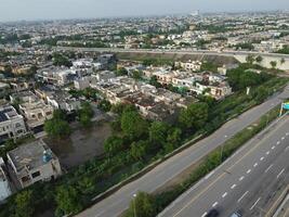 View at city from bird sight. City from drone. Aerial photo. City scape from drone on 2023-07-22 in Lahore Pakistan photo