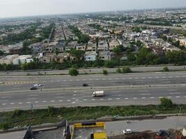 View at city from bird sight. City from drone. Aerial photo. City scape from drone on 2023-07-22 in Lahore Pakistan photo