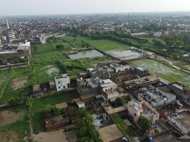 View at city from bird sight. City from drone. Aerial photo. City scape from drone on 2023-07-22 in Lahore Pakistan photo