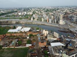 View at city from bird sight. City from drone. Aerial photo. City scape from drone on 2023-07-22 in Lahore Pakistan photo