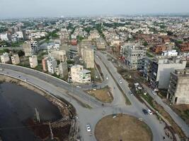 View at city from bird sight. City from drone. Aerial photo. City scape from drone on 2023-07-22 in Lahore Pakistan photo