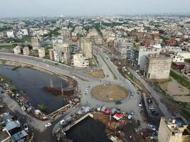 View at city from bird sight. City from drone. Aerial photo. City scape from drone on 2023-07-22 in Lahore Pakistan photo