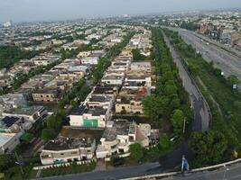 View at city from bird sight. City from drone. Aerial photo. City scape from drone on 2023-07-22 in Lahore Pakistan photo