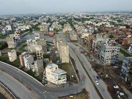 View at city from bird sight. City from drone. Aerial photo. City scape from drone on 2023-07-22 in Lahore Pakistan photo