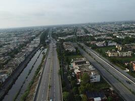 View at city from bird sight. City from drone. Aerial photo. City scape from drone on 2023-07-22 in Lahore Pakistan photo