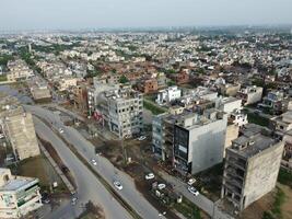 View at city from bird sight. City from drone. Aerial photo. City scape from drone on 2023-07-22 in Lahore Pakistan photo