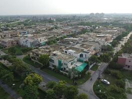 View at city from bird sight. City from drone. Aerial photo. City scape from drone on 2023-07-22 in Lahore Pakistan photo