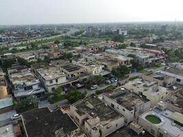 View at city from bird sight. City from drone. Aerial photo. City scape from drone on 2023-07-22 in Lahore Pakistan photo