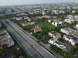 View at city from bird sight. City from drone. Aerial photo. City scape from drone on 2023-07-22 in Lahore Pakistan photo